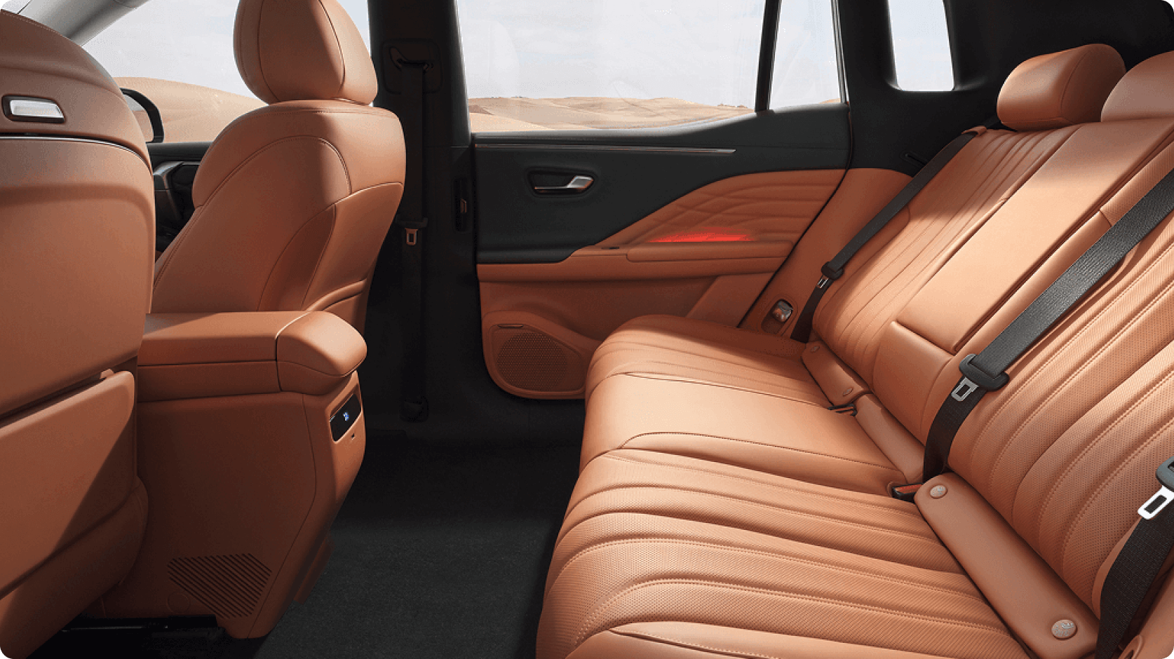 Rear passenger seating in the AION V with tan leather upholstery and generous legroom