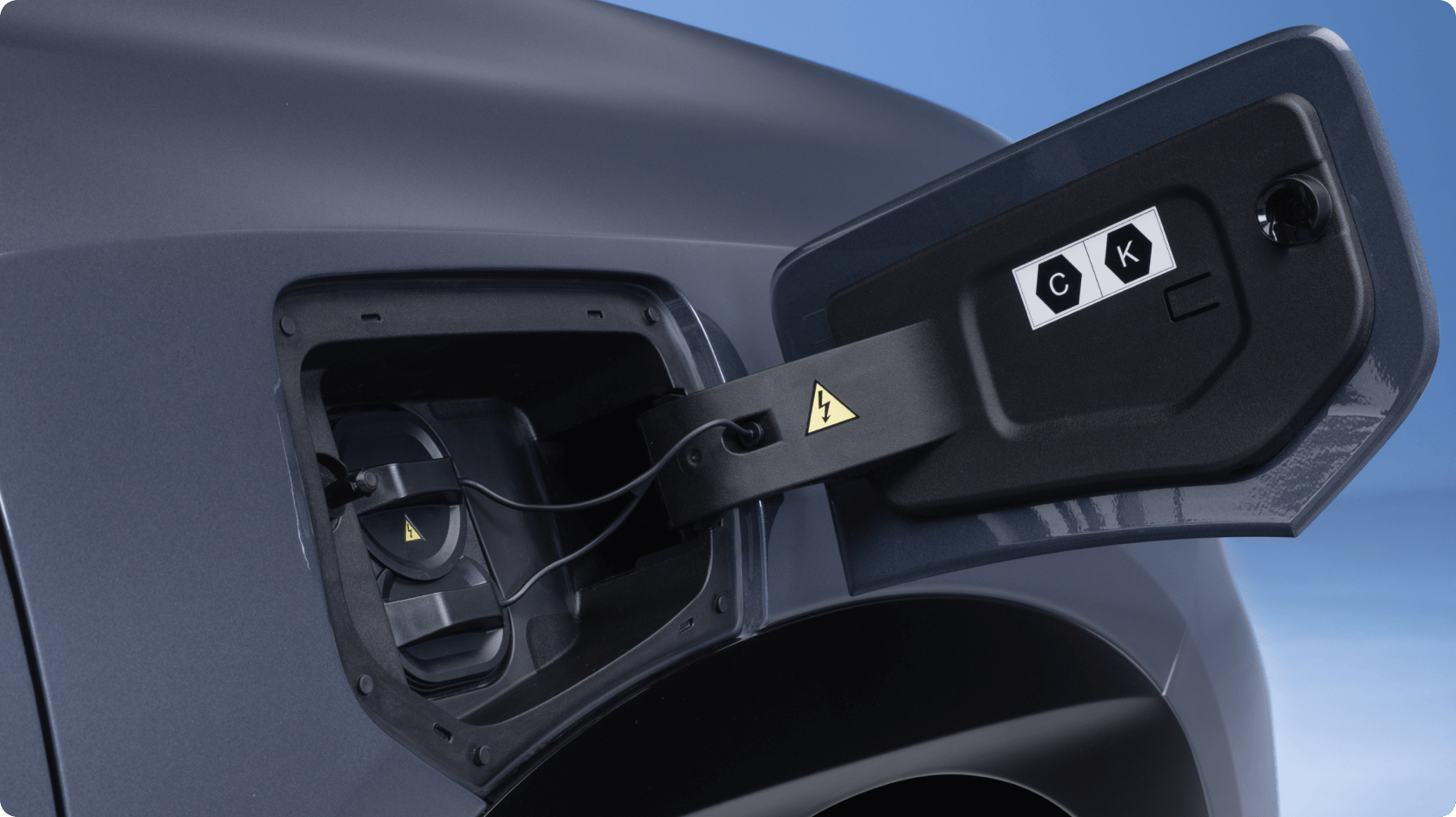 Close-up of an AION vehicle charging port with the flap open