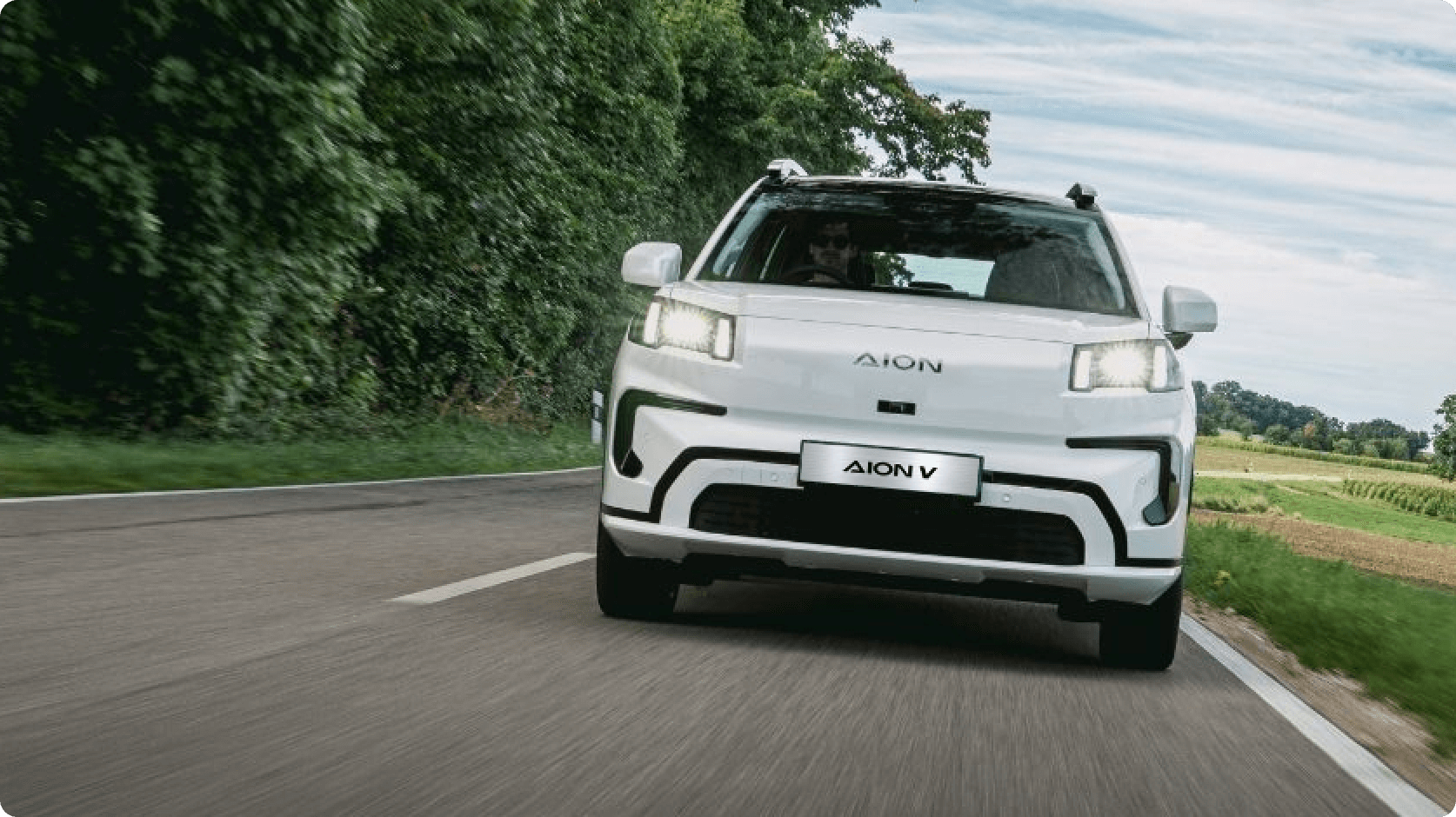 AION V driving on a country road