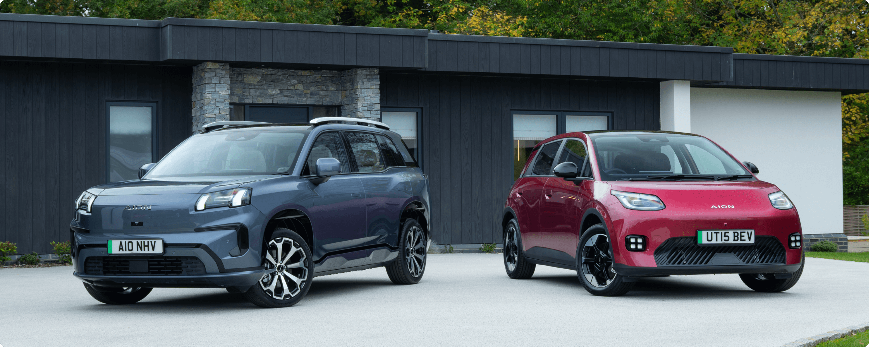 AION V and AION UT parked outside a modern home