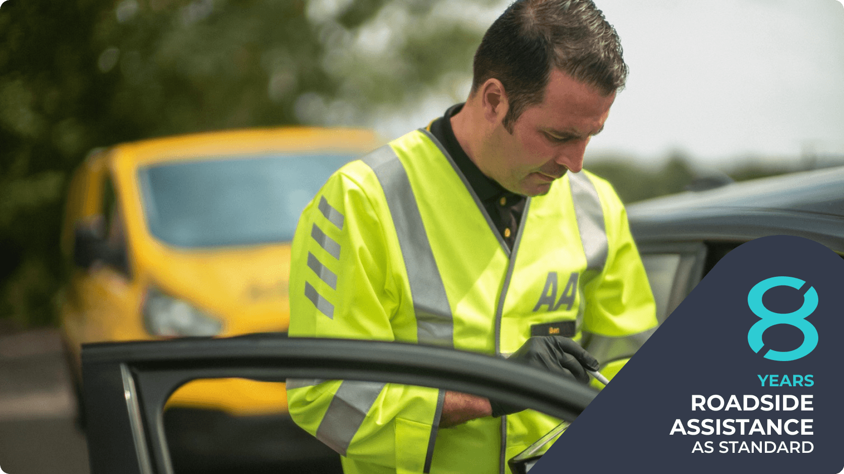 Roadside assistance technician checking a vehicle at the side of the road