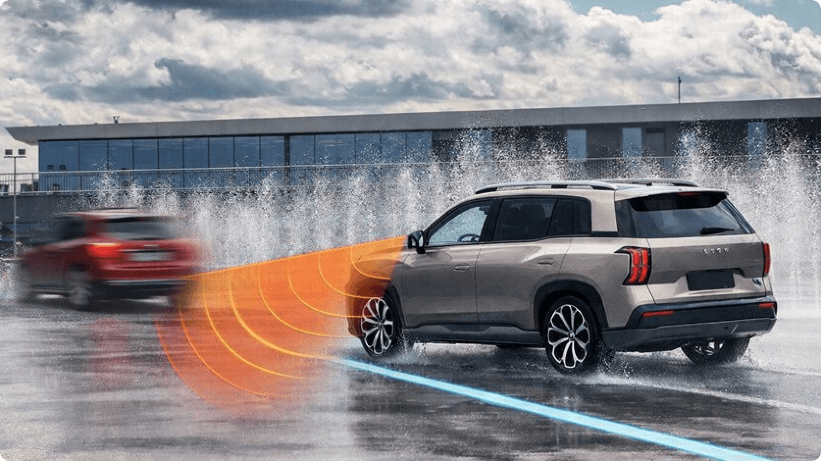 Illustration of an AION V demonstrating rear cross traffic alert by detecting an approaching vehicle while stationary