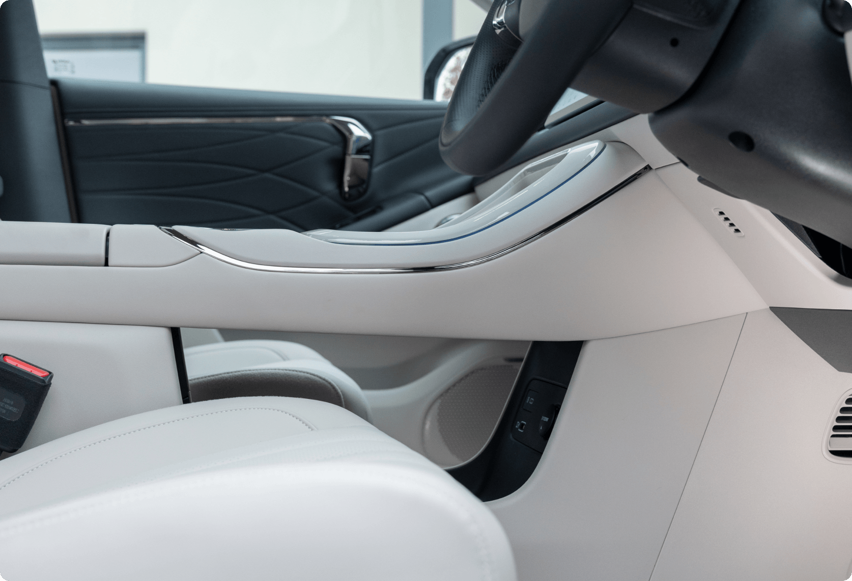 Minimalist AION V interior showing the floating centre console and front cabin storage space