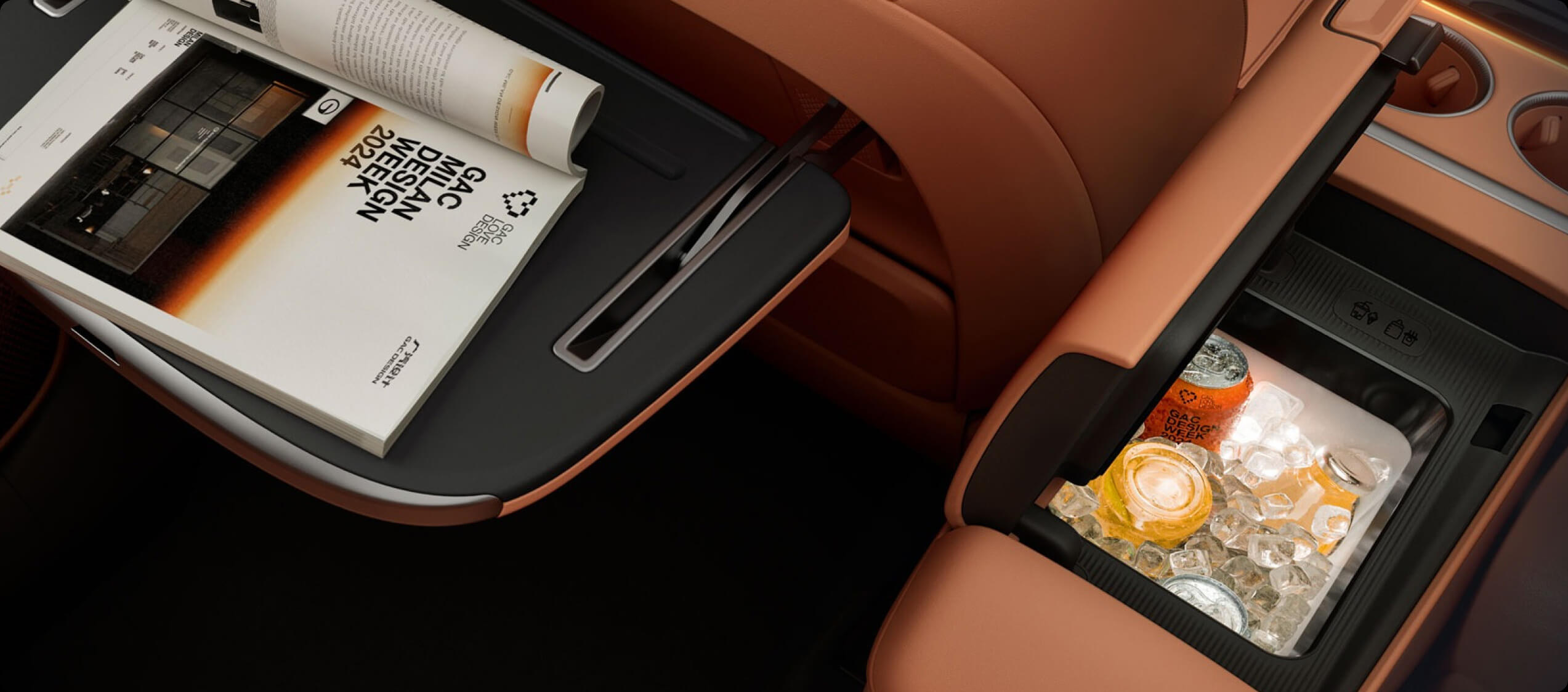AION V rear cabin featuring a fold-out tray table and centre console cooler filled with drinks and ice